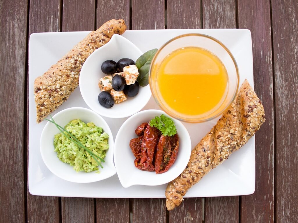 breakfast, orange juice, loaf, whole wheat, whole grain bread, guacamole, nourishment, yummy, meal, breakfast table, have breakfast, plate, healthy, tasty, food, vitamins, in the morning, breakfast, breakfast, breakfast, breakfast, breakfast, food