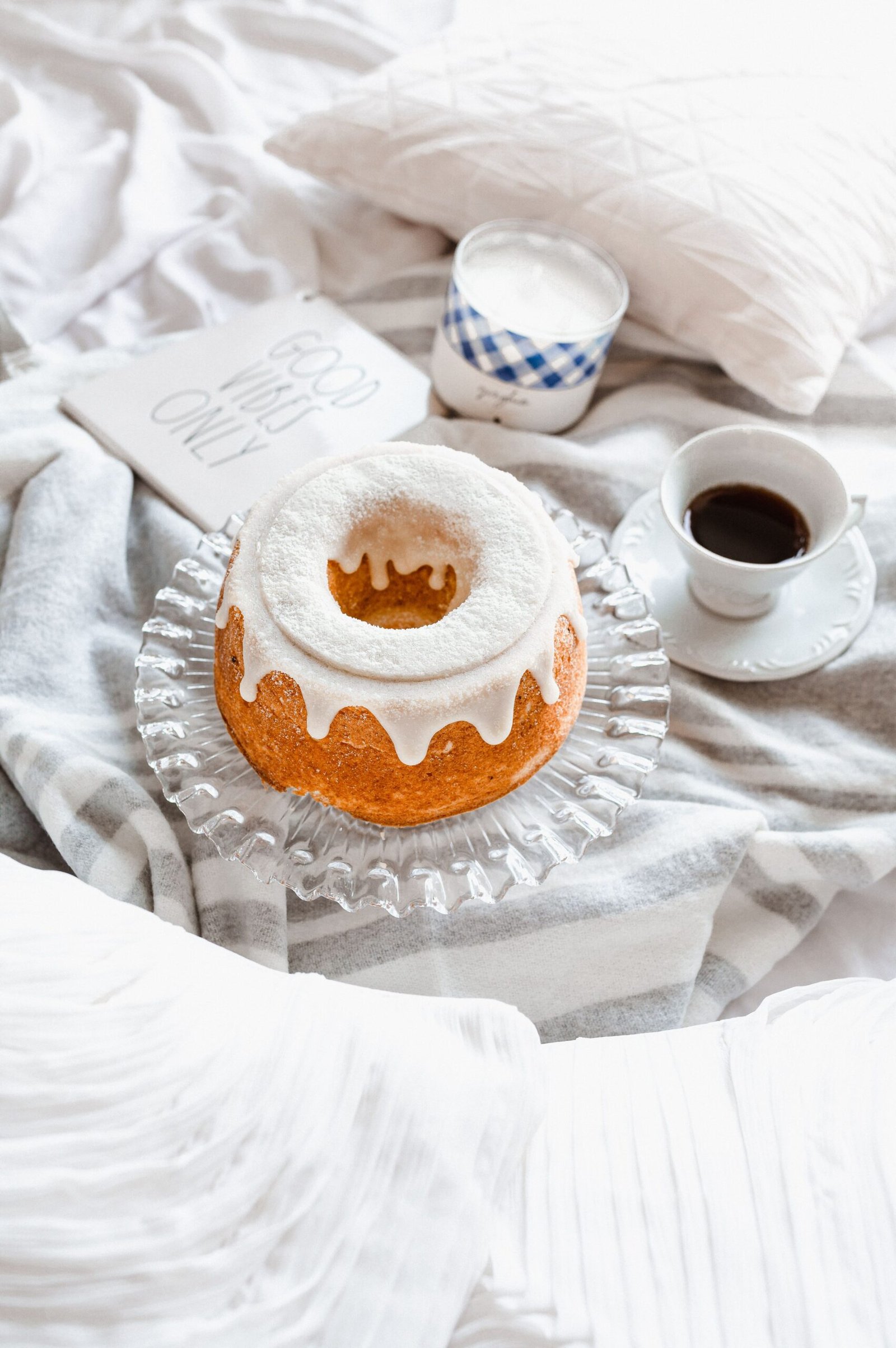 Vanilla breakfast bundt cake with white glaze and powdered sugar